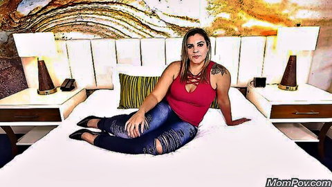 BBW Mommy Kiana lounging seductively in red top and ripped jeans