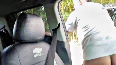 Lustful cougar bends over in car, exposing bare ass in white skirt