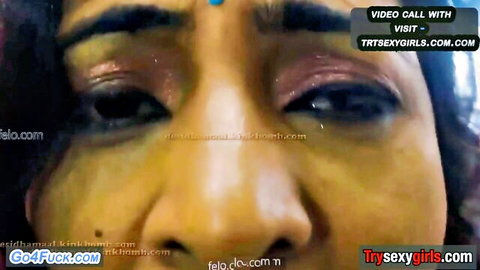 Seductive close-up of Indian bhabhi with glossy eyes in video call tease