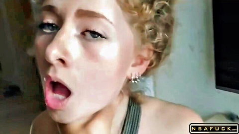 Blonde babe with curly hair and wide open mouth tongue out ready for blowjob