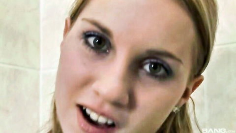 Blonde woman smiling close-up in bathroom, amateur solo masturbation video thumbnail