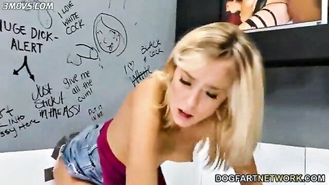 Haley Reed blonde poses topless in glory hole with black cock graffiti