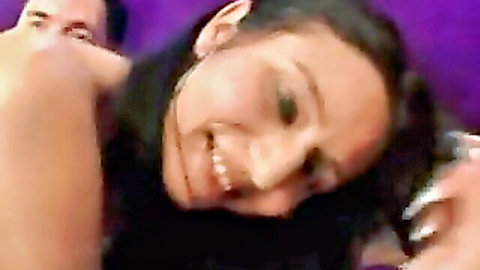 Smiling brunette teen looks up eagerly with man's hand on her neck in amateur casting tease