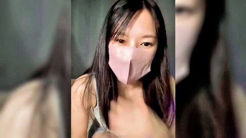 Seductive Asian babe in pink mask teasing with deep cleavage and big tits