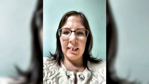 B_Bonya_m mature MILF cam model in white top and glasses, teasing open mouth