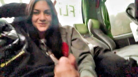 Smiling black-haired amateur enjoying handjob in vehicle