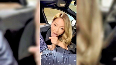Naomi West teases with finger suck in car parking lot