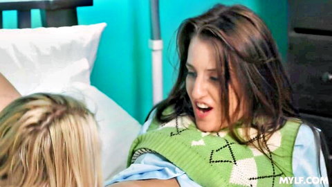 Brunette MILF moans mouth open during lesbian play with blonde on bed