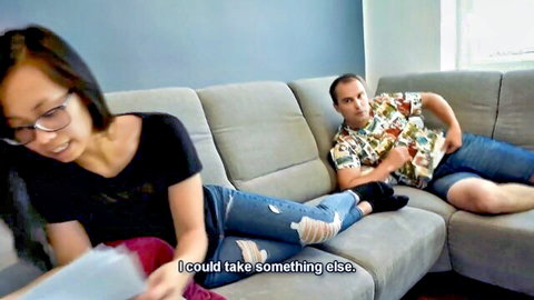 Asian woman in glasses and socks with man in foot fetish lesson scene