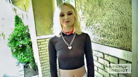 Blonde Natalia in sheer black top and choker, teasing outdoors for hookup