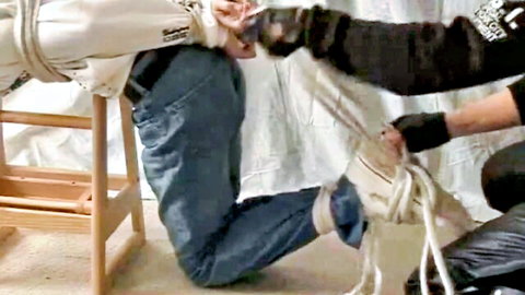 Pink boy bound in jeans during BDSM rope tying session pt 1