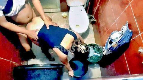 Amateur Asian woman bent over getting fucked doggy style in bathroom