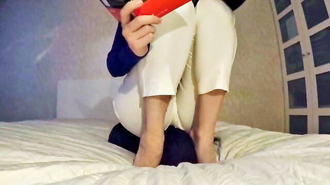 Ava Krass facesitting on man while reading book in tight white pants