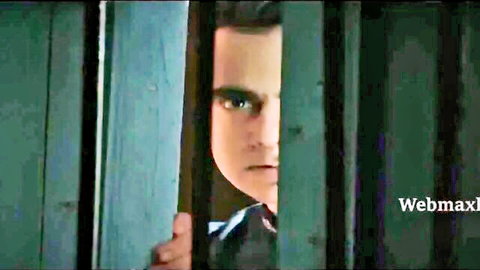 Intense Indian man peeking through bars in Ek Baar Aur Part 02 Ullu series