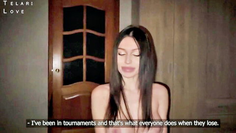 Topless brunette babe with big tits sits talking about tournament losses