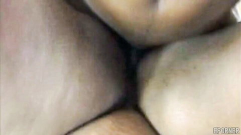 Close-up of woman's big pale ass cheeks spread wide revealing her tight puckered anus