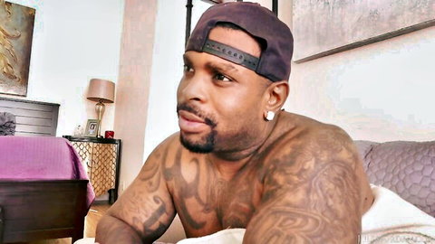 Muscular black man with tattoos in interracial gangbang preview