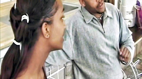 Gorgeous black girl in ponytail chats with man in casual kitchen scene