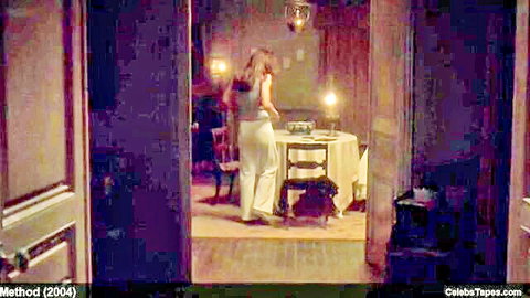 Elizabeth Hurley in seductive erotic movie scene, standing from behind in white pants