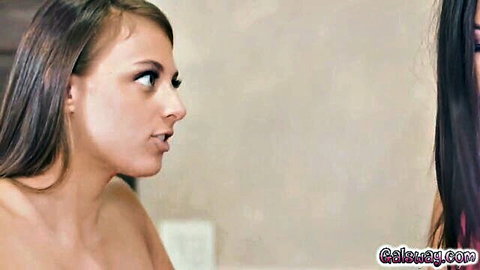 Gia leans in tonguing Kendra's hard nipple in lesbian tease, topless