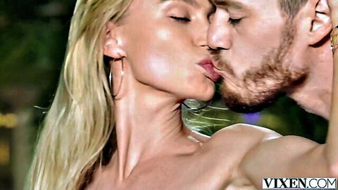 Blonde vixen passionately kissing muscular bearded stud outdoors by pool