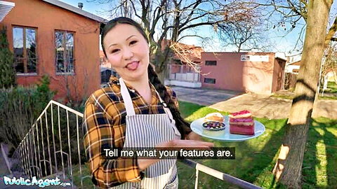 Luna Truelove Asian babe in plaid apron offers pink cream cake outdoors