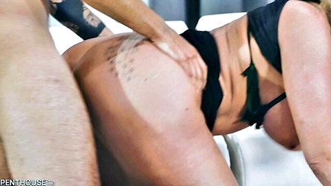 Tattooed man roughly grabs curvy blonde MILF's big ass in black lingerie