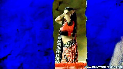 Sensual Bollywood woman dancing in red saree, exposing midriff