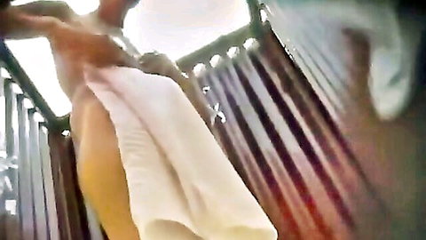 Voyeur spy cam of girl changing in cabin, exposing nude ass and pussy