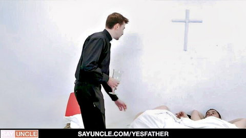 Priest in black stands over lingerie-clad woman on bed, religious cross backdrop