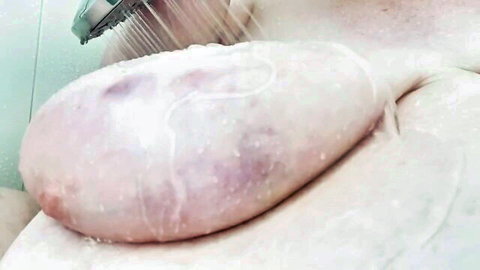 SSBBW Evie lathering her huge soapy breast in steamy shower