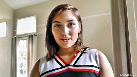 Anastasia Knight in cheerleader outfit smiling seductively