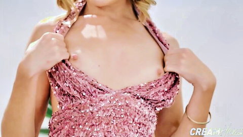 Blonde babe teasing with exposed perky tits in sparkly pink dress