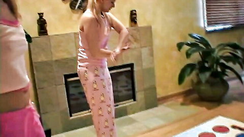 Little Summer in cute pink penguin pajamas, playful striptease pose