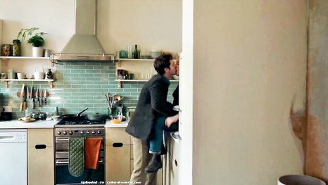 Florence Pugh in passionate kitchen kiss with lover, romantic embrace
