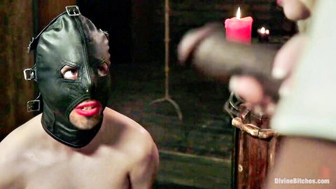 BDSM mistress prepares masked male sub as pleasure tool in femdom scene