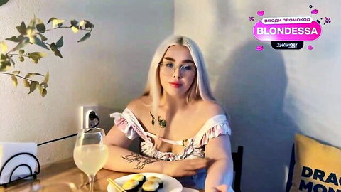 Blondessa blonde Russian in sexy frilly white top, tattoos and glasses