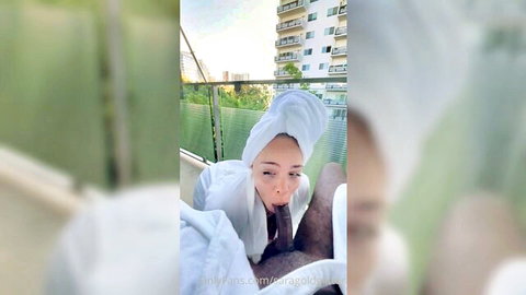 Sara G sucking big black cock on balcony in open robe