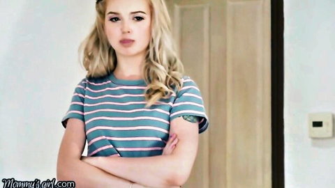 Blonde Lexi Lore arms crossed in striped shirt, stern expression