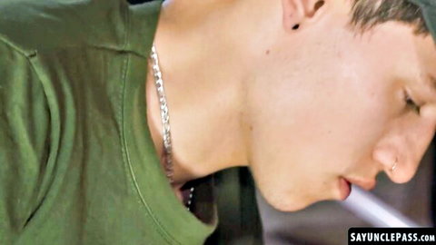 Jake Lotti close-up in green shirt, seductive profile in gay barracks scene