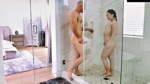 Nude Asian beauty and muscular man in steamy shower encounter, 4K exotic action