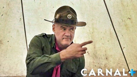 Noah White as sexy scout in uniform pointing intensely