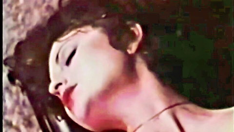 Retro porn star Marianne in ecstatic close-up, brunette with pale skin