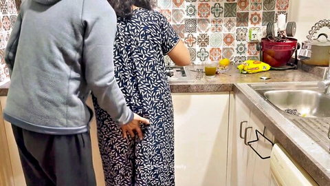 Cougar stepmom in black dress groped from behind in steamy kitchen tease