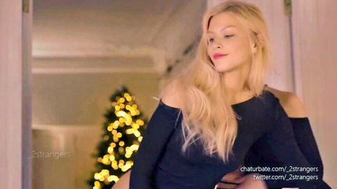 Blonde _2strangers in sexy black off-shoulder top, smiling holiday vibe