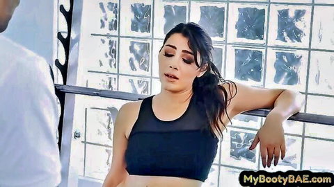 Curvy brunette babe in sports bra teased by black trainer in gym