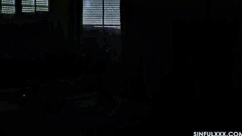 Dimly lit dark room with glowing windows in Thieves and Sinners adult video