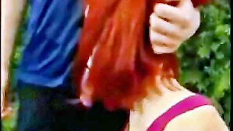 Redhead sister in pink top embraced by brother in park, stepdad filming taboo scene
