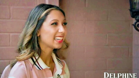 Kimora Quin smiling as door-to-door sales babe in pink uniform