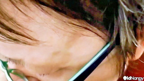 Mature woman in glasses, profile view, from fluffy mom lesbian licking video